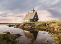 Old wooden Church built for the filming of `The Island` in the White sea at sunset, Rabocheostrovsk, Karelia Royalty Free Stock Photo