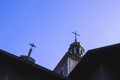 Old wooden Church with the crosses on the domes against the blue Royalty Free Stock Photo