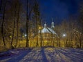 Old wooden church dedicated to St. Trinity Church in Koszecin, Poland. View at night Royalty Free Stock Photo