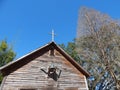 Old wooden church stands in the woods