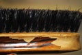 Old wooden clothes brush close up Royalty Free Stock Photo