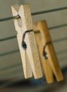 Old wooden clothespeg hanging on rope Royalty Free Stock Photo