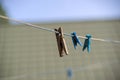 Old wooden clothespin on a rope Royalty Free Stock Photo