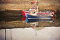 Old wooden colored boat moored Ireland