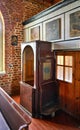Old wooden confessional box in a church Royalty Free Stock Photo