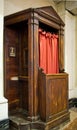 Old wooden confessional in the church Royalty Free Stock Photo