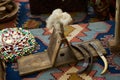 Old wooden cotton spindle with a ball of wool thread, close-up