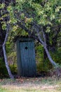 old wooden countryside toilet house with heart shaped hole in th Royalty Free Stock Photo