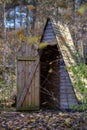 old wooden countryside toilet house with heart shaped hole in th Royalty Free Stock Photo