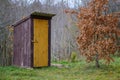 old wooden countryside toilet house with heart shaped hole in th Royalty Free Stock Photo