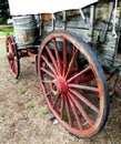 Old Wooden Covered Wagon and water barrel. Royalty Free Stock Photo