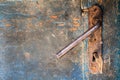 Old wooden cracked door with iron rusty lock and key Royalty Free Stock Photo