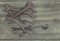 Old wrenches on a wooden background. Royalty Free Stock Photo