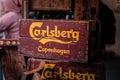 Old wooden crates of Carlsberg beer stand in a bar in Copenhagen