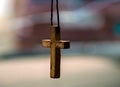 Old wooden cross on a thread Royalty Free Stock Photo