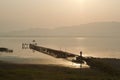 Old wooden dock on Dojran Lake at sunset Royalty Free Stock Photo