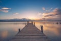 Old wooden dock at the lake, sunset shot Royalty Free Stock Photo