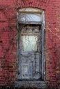 Old wooden door from an abandoned red brick house that has since been torn down, Ottawa, Canada Royalty Free Stock Photo