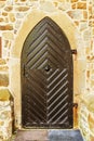 Old wooden door in ancient beautiful building Royalty Free Stock Photo