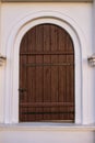 Old wooden door in ancient beautiful building Royalty Free Stock Photo