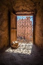 Old wooden door in ancient moroccan kasbah in Ait benhaddou clay city in Morocco