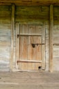 Old wooden door in the ancient structure of the boards. Secret or hidden information.