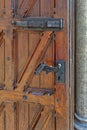 An old wooden door with an antique locks