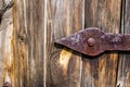 Old wooden door background and rusty metal hinge Royalty Free Stock Photo