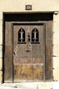 Old wooden door with black wrought details