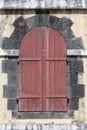 Old wooden door in a brick archway. Close up Royalty Free Stock Photo