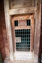 Old wooden door and brick walk outside historic fortress Royalty Free Stock Photo