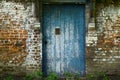 Old wooden door in the wall Royalty Free Stock Photo