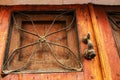 Old wooden door with bronze knocker Royalty Free Stock Photo