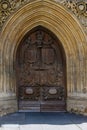 The carved wooden door of the Abbey in Bath Royalty Free Stock Photo