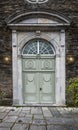 Old wooden door of city church in Monschau, Germany.