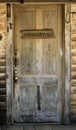 Old wooden door with Commissary sign