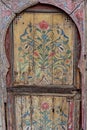 Old wooden door decorated with flower drawing ornaments, Marrakesh, Morocco Royalty Free Stock Photo