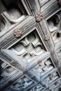 Old wooden door with floral ornament. Royalty Free Stock Photo