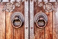 Old wooden door with forged parts Royalty Free Stock Photo