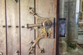 Old wooden door with a forged steel handle Royalty Free Stock Photo