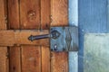 Old wooden door with a forged steel handle Royalty Free Stock Photo