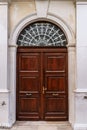 Old wooden door with glass in ancient building Royalty Free Stock Photo