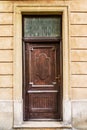 Old wooden door with glass in ancient building Royalty Free Stock Photo