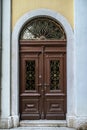 Old wooden door with glass in ancient building Royalty Free Stock Photo