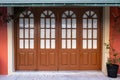 Old wooden door with glass windows in old town in Europe. Entrance of house with arched wooden door and transom window Royalty Free Stock Photo