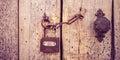 Old wooden door with a handle, chain and lock. Boho style Royalty Free Stock Photo