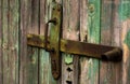 Old Wooden Door With Handle. An Old Wooden Door With Cracked Paint. Background. Handle With Keyhole. The Old Iron Royalty Free Stock Photo