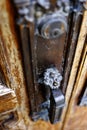 Old Wooden Door Handles with Rusted Metal and worn Grip Royalty Free Stock Photo