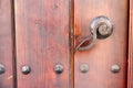 Old wooden door handle with rusty needles Royalty Free Stock Photo