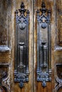 Old Wooden Door Handles with Rusted Metal and worn Grip Royalty Free Stock Photo